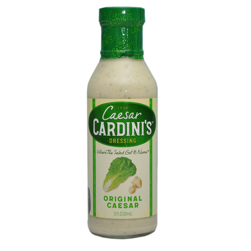 Cardinis Caesar Dressing bottle on a fresh salad